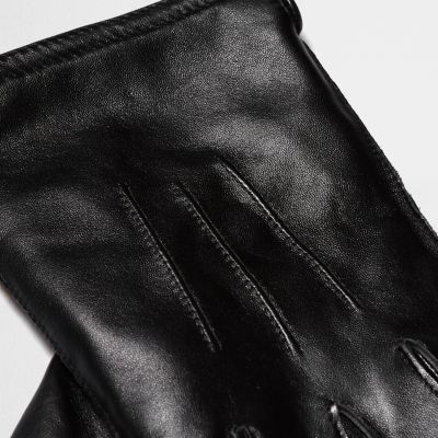 Black leather gloves in a gift box